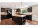 Kitchen featuring dark cabinets, an island, stainless appliances, and an open design at 3035 Agean Ln, York, SC 29745