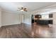 Open-concept living space with hardwood floors seamlessly flowing into a modern kitchen at 3035 Agean Ln, York, SC 29745