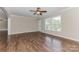 Bright living room with hardwood floors, white trim, and double windows offering natural light at 3035 Agean Ln, York, SC 29745