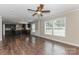 Inviting living area with abundant natural light and wood flooring flowing into the kitchen at 3035 Agean Ln, York, SC 29745