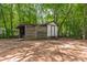 A back-yard shed among the trees at 3035 Agean Ln, York, SC 29745