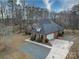 House with a gray roof, driveway, and surrounding trees at 3119 Drake Ln, Monroe, NC 28110