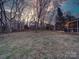 Spacious backyard with string lights, creating a magical ambiance at 3119 Drake Ln, Monroe, NC 28110