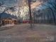 Large backyard with storage shed and string lights at 3119 Drake Ln, Monroe, NC 28110