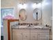 Bathroom with double vanity and granite countertop at 3119 Drake Ln, Monroe, NC 28110