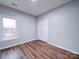 Bedroom with hardwood floors and a window at 3119 Drake Ln, Monroe, NC 28110