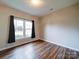 Bright bedroom with hardwood floors and a window at 3119 Drake Ln, Monroe, NC 28110