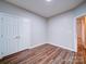 Bedroom with hardwood floors and double doors at 3119 Drake Ln, Monroe, NC 28110