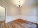 Bright dining room features hardwood floors, crown molding, and wainscoting at 3119 Drake Ln, Monroe, NC 28110