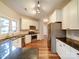 Modern kitchen with white cabinets, granite countertops, and stainless steel appliances at 3119 Drake Ln, Monroe, NC 28110