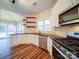 Modern kitchen with white cabinets, granite countertops, and stainless steel appliances at 3119 Drake Ln, Monroe, NC 28110