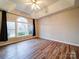 Main bedroom with hardwood floors and large windows at 3119 Drake Ln, Monroe, NC 28110