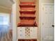 Built-in wet bar with wine rack and rustic wood shelving at 3119 Drake Ln, Monroe, NC 28110