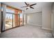 Bright bedroom with large windows offering city views and access to the balcony at 315 Arlington Ave # 604, Charlotte, NC 28203