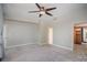 Spacious bedroom with a ceiling fan and an adjacent walk-in closet at 315 Arlington Ave # 604, Charlotte, NC 28203