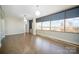 Bright living space with hardwood floors, sleek lighting, and expansive windows with stunning views at 315 Arlington Ave # 604, Charlotte, NC 28203