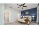 Bright main bedroom boasting a modern ceiling fan, accent wall, and ensuite bathroom access at 315 Arlington Ave # 604, Charlotte, NC 28203