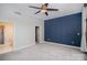 Spacious main bedroom with a ceiling fan, accent wall, and ensuite bathroom at 315 Arlington Ave # 604, Charlotte, NC 28203