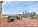 Outdoor terrace with seating areas and city skyline views at 315 Arlington Ave # 604, Charlotte, NC 28203