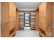 Spacious walk-in closet with custom wood cabinetry and a large mirror at 315 Arlington Ave # 604, Charlotte, NC 28203