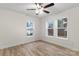 Spacious bedroom featuring hardwood floors and multiple windows at 315 W 2Nd St, Cherryville, NC 28021