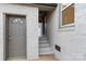 Exterior view showing grey door and brick walkway leading to home at 315 W 2Nd St, Cherryville, NC 28021