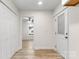 Clean hallway with white doors and light wood flooring at 315 W 2Nd St, Cherryville, NC 28021