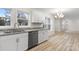 Bright kitchen with granite countertops, white cabinets, and a view to the dining area at 315 W 2Nd St, Cherryville, NC 28021