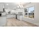 Modern kitchen with white cabinets, granite countertops, and a window view at 315 W 2Nd St, Cherryville, NC 28021