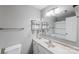 Well-lit bathroom featuring a marble countertop, decorative mirror, and neutral color scheme at 3153 Wimbledon Ln, Rock Hill, SC 29732