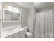 Bathroom featuring a double sink vanity, a toilet, and a shower with a gray plaid shower curtain at 3153 Wimbledon Ln, Rock Hill, SC 29732