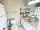 Bathroom featuring a white vanity, updated lighting, neutral colored walls and a mirror at 3153 Wimbledon Ln, Rock Hill, SC 29732