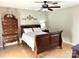 Comfortable bedroom with dark wood furniture and light hardwood floors at 3153 Wimbledon Ln, Rock Hill, SC 29732