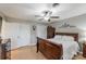 Cozy bedroom with a ceiling fan, hardwood floors, and two double-door closets for ample storage space at 3153 Wimbledon Ln, Rock Hill, SC 29732