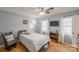 Cozy bedroom featuring hardwood floors, two windows and a ceiling fan at 3153 Wimbledon Ln, Rock Hill, SC 29732