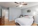 Bedroom with hardwood floors, a window, and an open doorway leading to the ensuite bathroom at 3153 Wimbledon Ln, Rock Hill, SC 29732