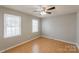 Bright bedroom with two windows offering natural light and hardwood floors at 3153 Wimbledon Ln, Rock Hill, SC 29732