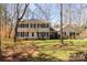 Classic two-story home with black shutters and a manicured front yard in a quiet, wooded setting at 3153 Wimbledon Ln, Rock Hill, SC 29732