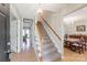 Inviting foyer featuring a staircase, wood floors, and views into the dining and living areas at 3153 Wimbledon Ln, Rock Hill, SC 29732