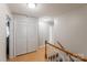 Hallway with hardwood floors, leading to various rooms with storage closet at 3153 Wimbledon Ln, Rock Hill, SC 29732