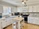 Kitchen with white cabinets, a center island with seating, and updated countertops at 3153 Wimbledon Ln, Rock Hill, SC 29732