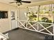 Cozy screened in porch with a porch swing and ceiling fan at 3153 Wimbledon Ln, Rock Hill, SC 29732