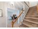 Carpeted staircase leading to the upper level, adjacent to a home office and living space at 3153 Wimbledon Ln, Rock Hill, SC 29732