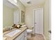 Bathroom with light green walls, granite countertop vanity, toilet, and white door at 3207 Oliver Stanley Trl, Lancaster, SC 29720