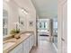 Bathroom featuring double sinks, granite countertop, and a door opening to a bedroom and shower at 3207 Oliver Stanley Trl, Lancaster, SC 29720