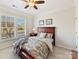 Bright bedroom with window shutters, ceiling fan and neutral decor create a calm and relaxing space at 3207 Oliver Stanley Trl, Lancaster, SC 29720