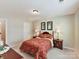 Bedroom featuring floral bedding, bedside tables with lamps, and ample natural light at 3207 Oliver Stanley Trl, Lancaster, SC 29720