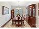 Formal dining room with a chandelier, hardwood floors, and elegant furnishings at 3207 Oliver Stanley Trl, Lancaster, SC 29720