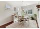 Charming dining area with natural light, a classic chandelier, and neutral-toned rug and decor at 3207 Oliver Stanley Trl, Lancaster, SC 29720