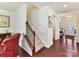 Hallway with wood floors, staircase, and view of the home's entry at 3207 Oliver Stanley Trl, Lancaster, SC 29720